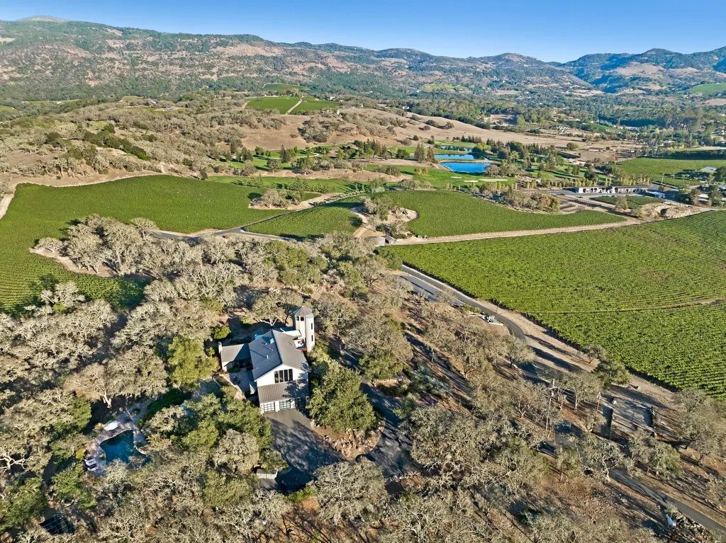 Aerial view of the founders’ property among oaks and vineyards with the Napa hills behind